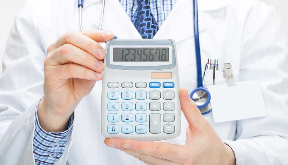 Doctor holding calculator, Quiz: Retirement Health Care Costs