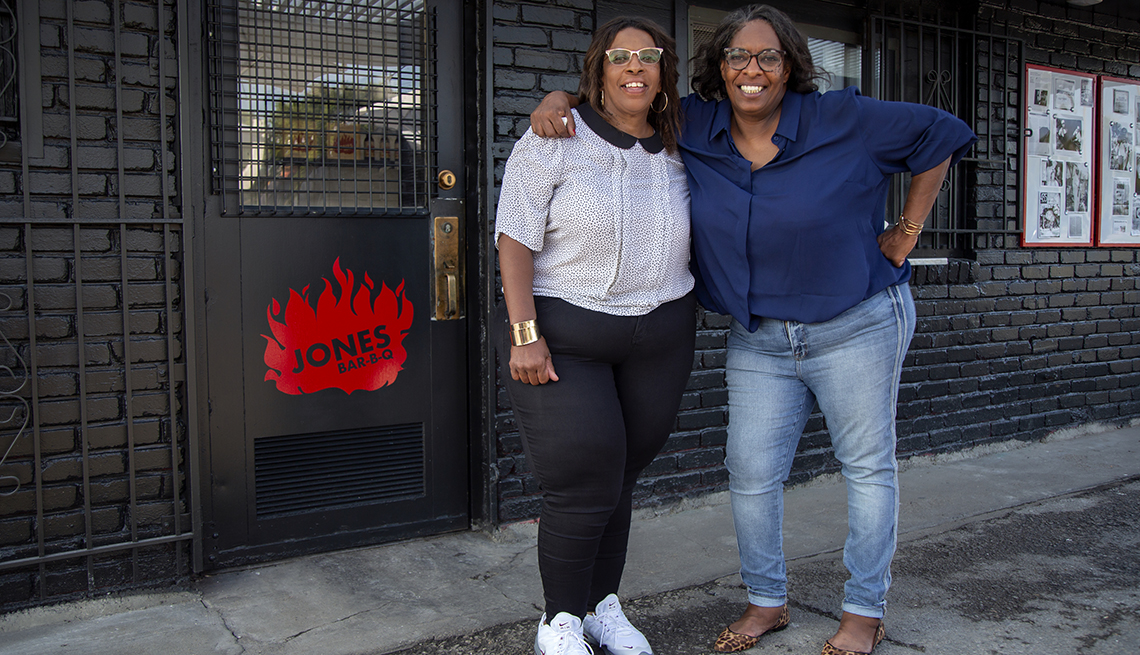 Jones sisters in front of their B B Q place.