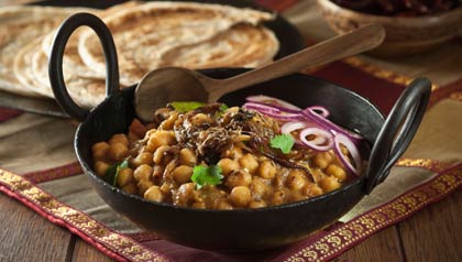 Chana Masala es un plato vegetal popular en la cocina india. El ingrediente principal es garbanzos. Es seco y picante., C26F04