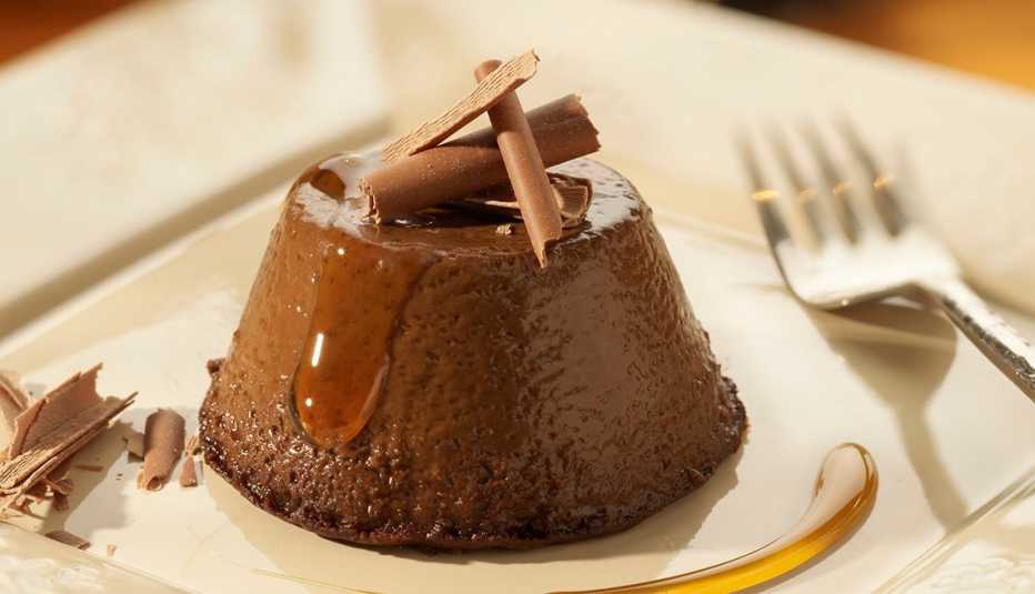 Close Up Of Chocolate Flan Dessert On Plate With Fork, AARP Food And Recipes, Christmas Recipes (Spanish)