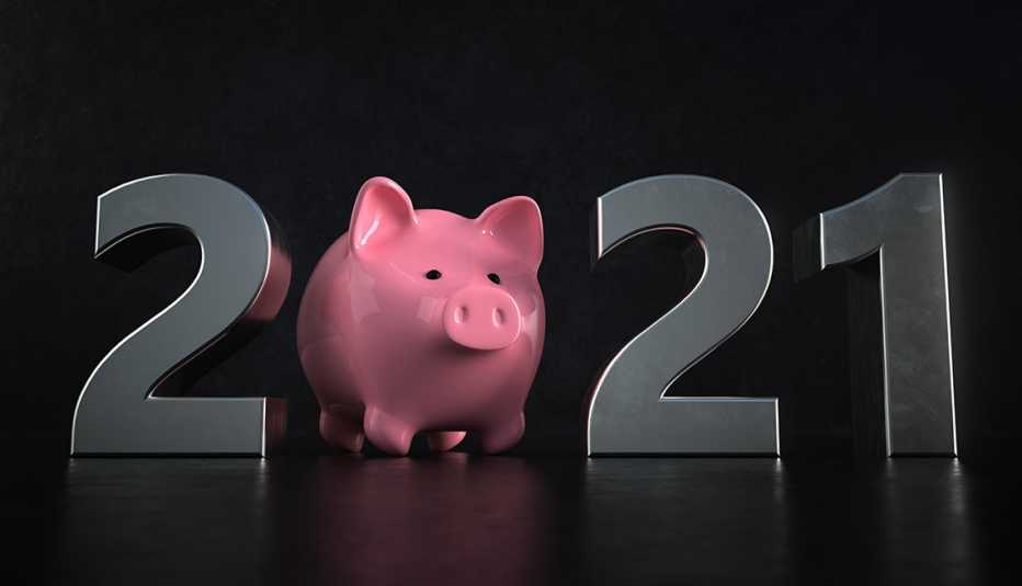 Una alcancía rosa reemplaza el cero en una pantalla que representa el año nuevo 2021.