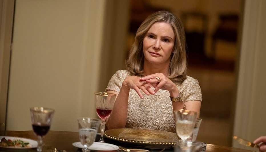 jennifer jason leigh sitting at a dinner table in a scene from season five of the fx series fargo