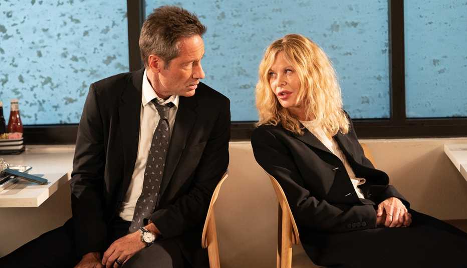 David Duchovny and Meg Ryan sitting in chairs talking to each other in the film "What Happens Later."