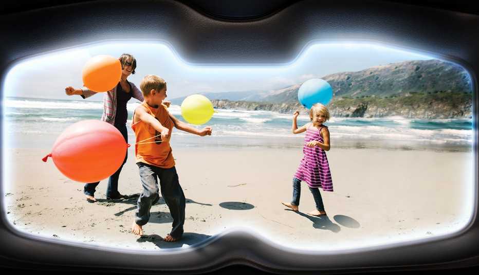 A photo of children on a beach as seen through VR goggles. 