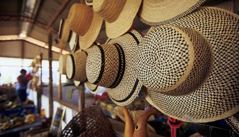 A Row Of Hats Hanging For Sale In Santa Fe Panama, Cheap Places To Retire