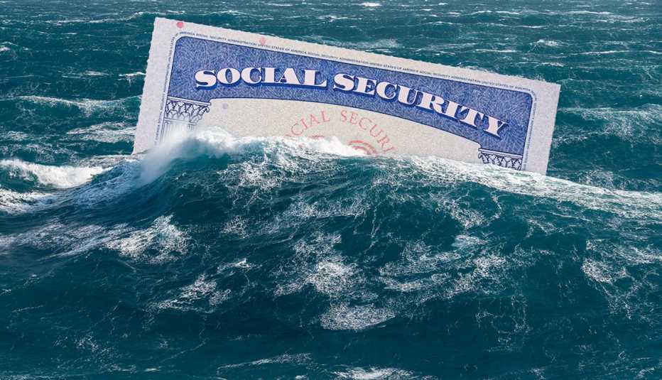 Una tarjeta de Seguro Social se hunde bajo una ola en el océano