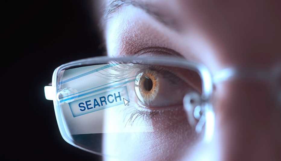 internet search engine reflected in a woman's glasses 