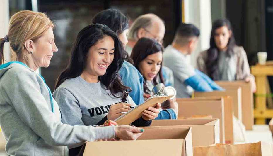 Diverse Adults Packing Donation Boxes, Mother Daughter Destinations Getaways
