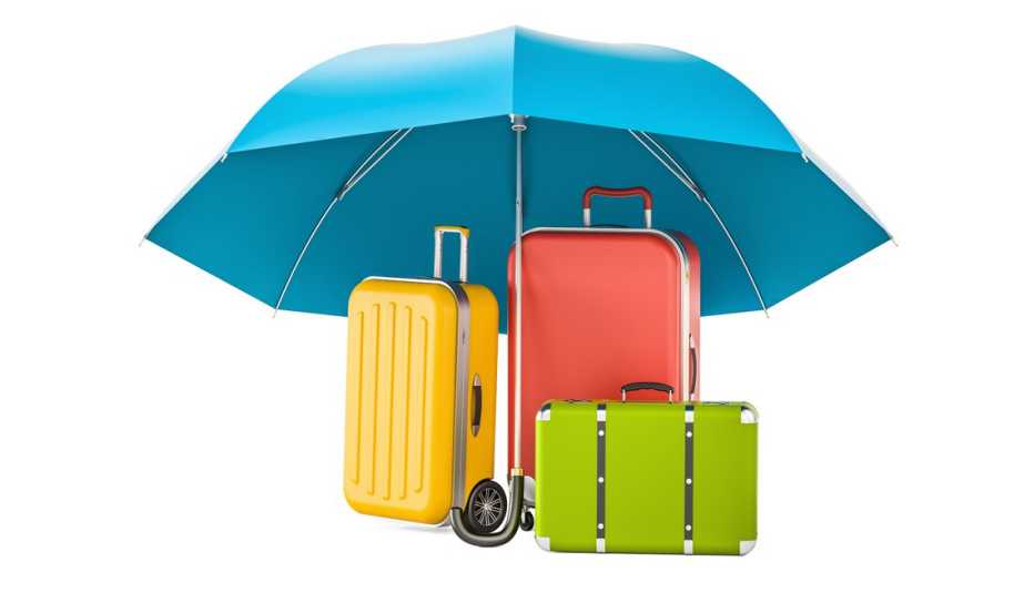 Sombrilla cubre tres maletas de viaje