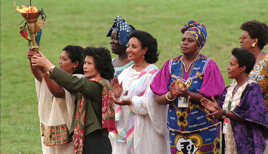 Women, different cultures of the world, "peace torch," opening ceremony, Non-Governmental Organizations Forum on Women, Beijing, 1995. 