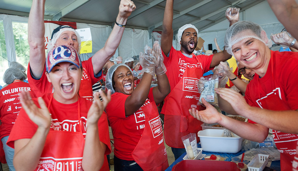 Volunteers pack meals during AARP Foundation's A Celebration of Service event on the National Mall in Washington, D.C. on Friday, September 11, 2015