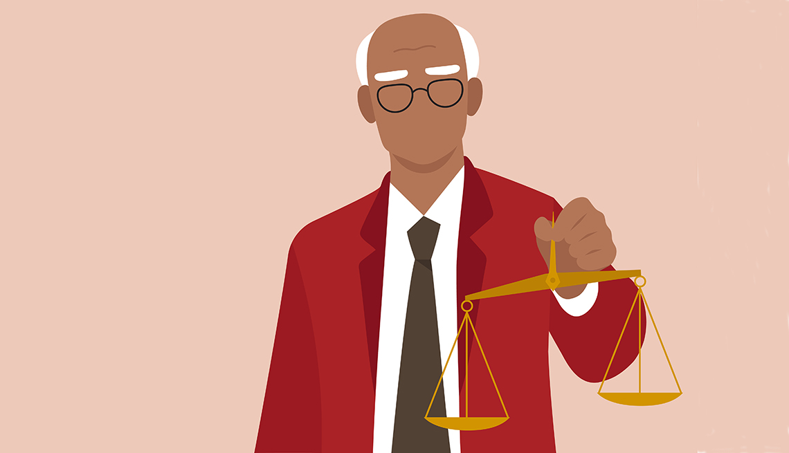 Older man holding justice scales