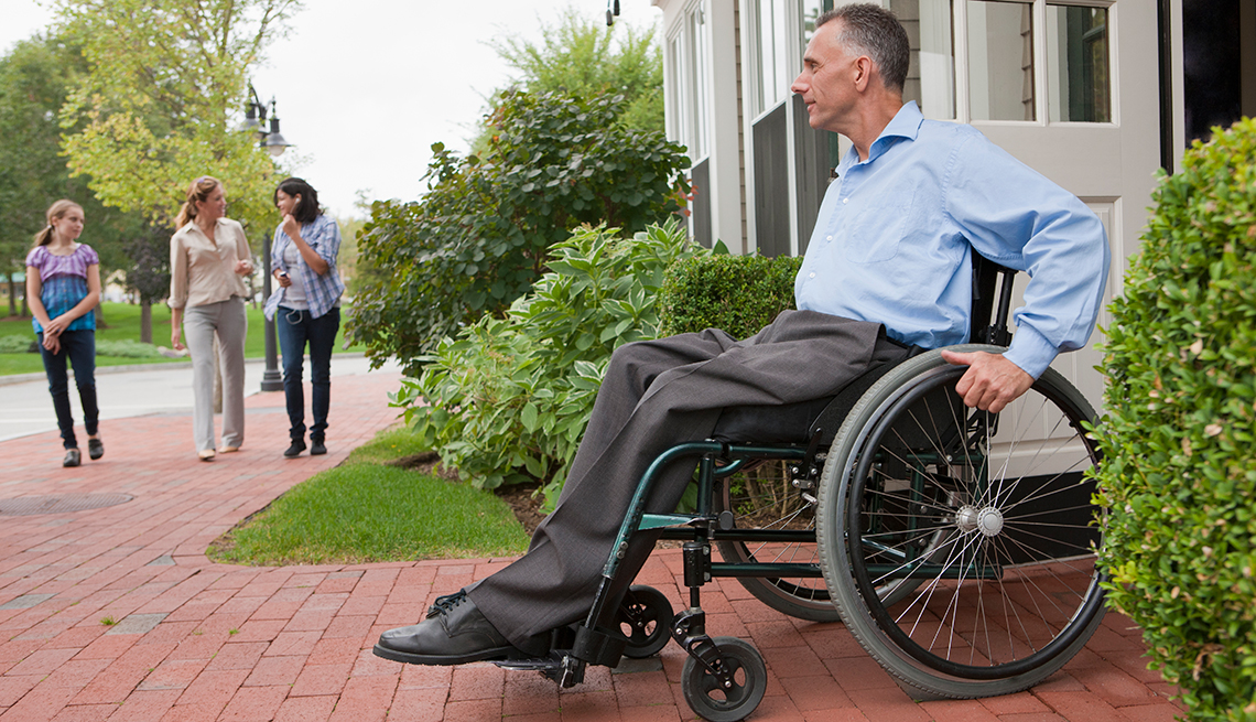 Mature man, wheelchair, exiting house, AARP Foundation, Housing, Our Work