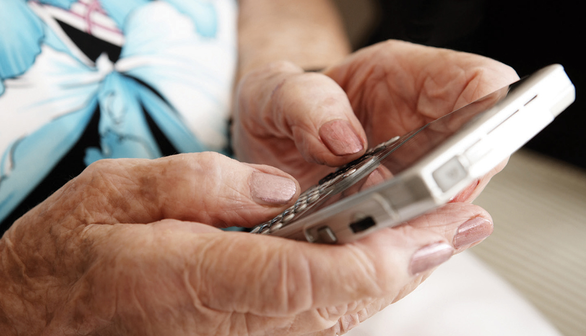 Mature Woman, texting, smart phone, Identfying fraud