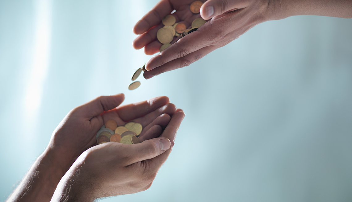 Hands Passing coins, Ways to Give, Donate, AARP Foundation