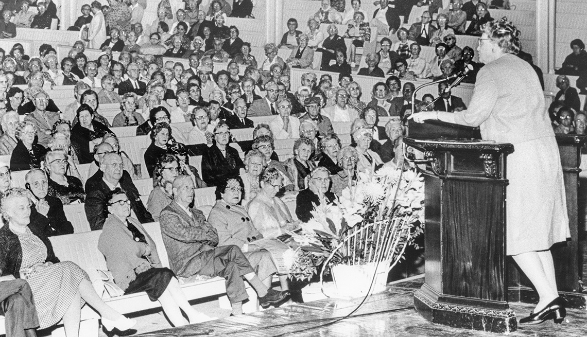 Ethel Percy Andrus on stage speaking to a crowd.