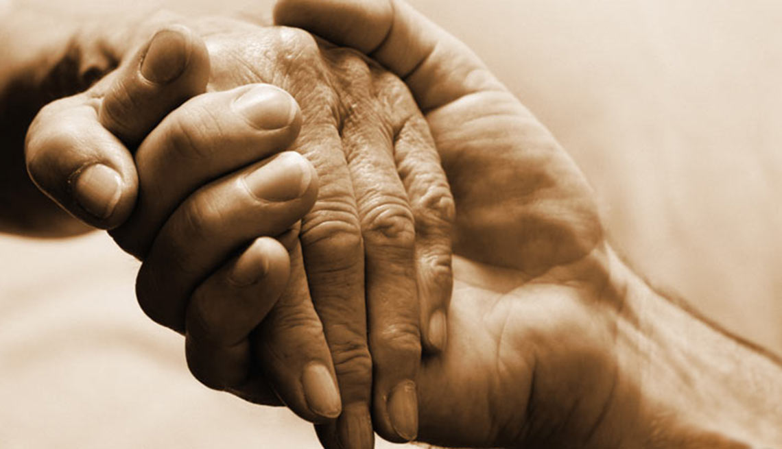 Young and Elderly Person Holding Hands