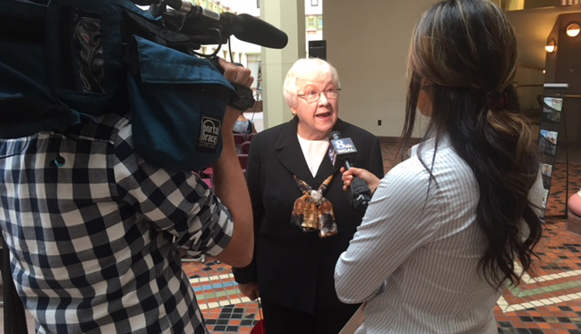 Mary Bach speaking with reporters