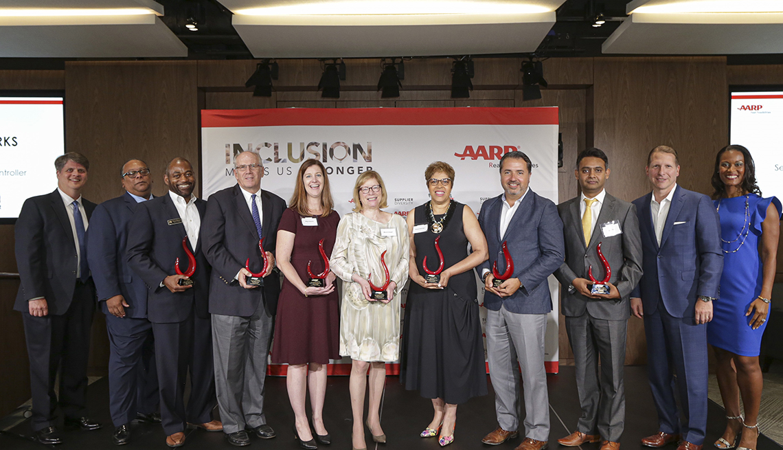Seven award winners from A A R P 3rd Annual Supplier Diversity Awards and Recognition Program holding their awards