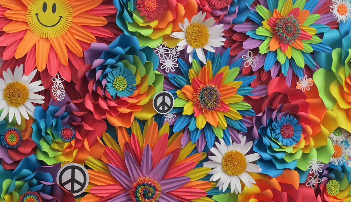 Collage of bright colored flowers, peace signs and smiley faces