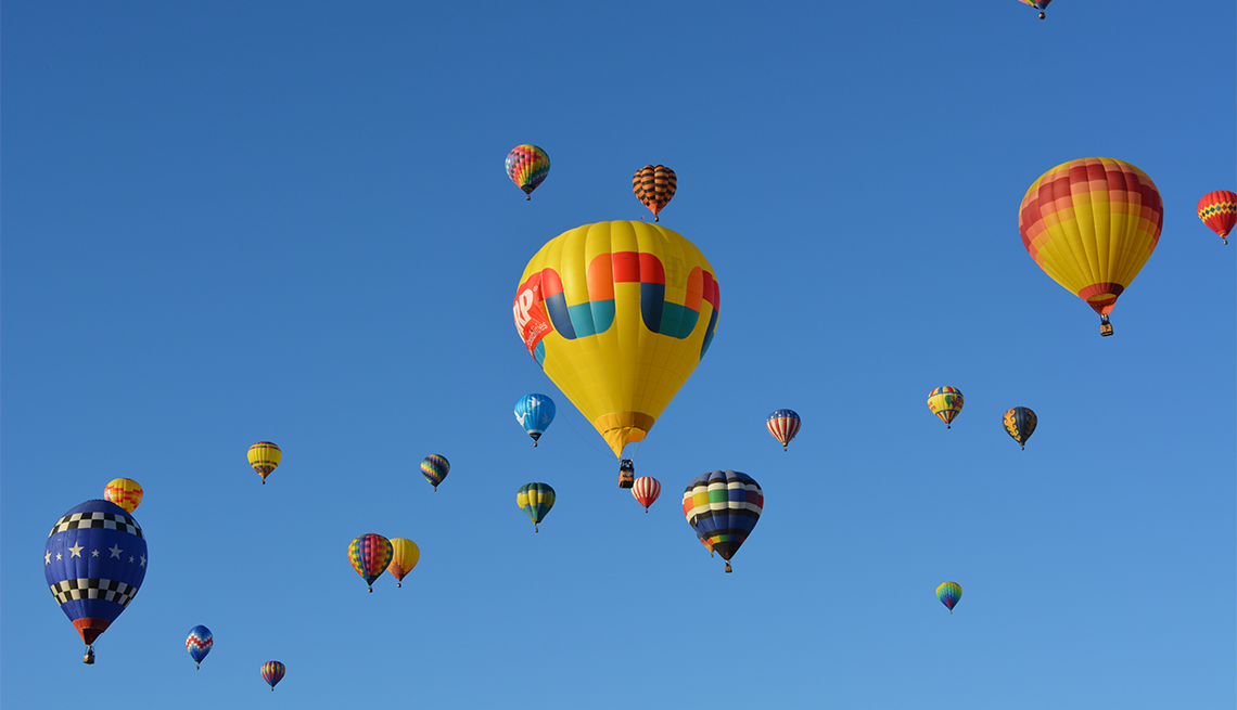 A large group of hot air balloons in the sky