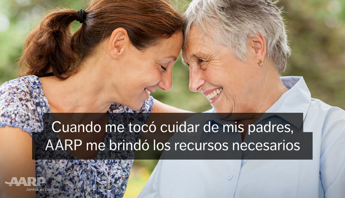 Young caregiver rests her forehead against her elderly female patient's forehead with text that reads cuando me toco cuidar de mis padres A A R P me brindo los recursos necesarios.