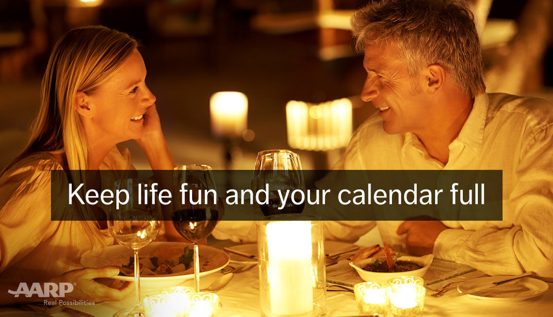 item 9 of Gallery image - A young caucasian couple enjoy a dinner outdoors with text that reads keep life fun and your calendar full.
