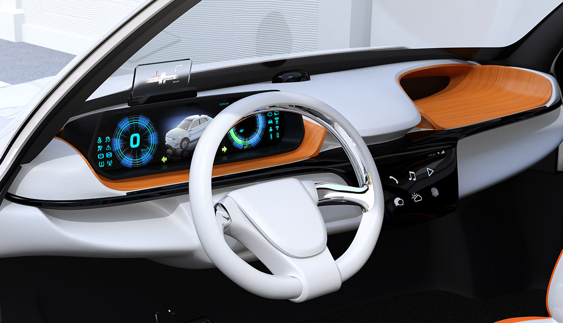 Closeup view of digital speedometer with HUD on wooden tray. Electric car's dashboard concept.