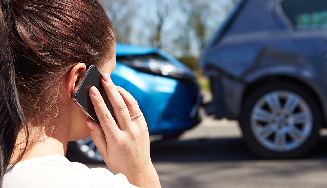 female calling car insurance company after an accident