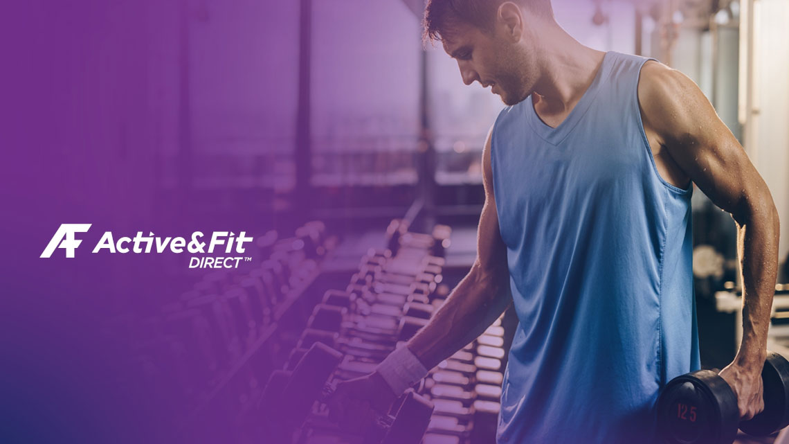 active and fit direct logo in white lettering on purple background with fit man wearing blue tank top is grabbing hand weights from shelf
