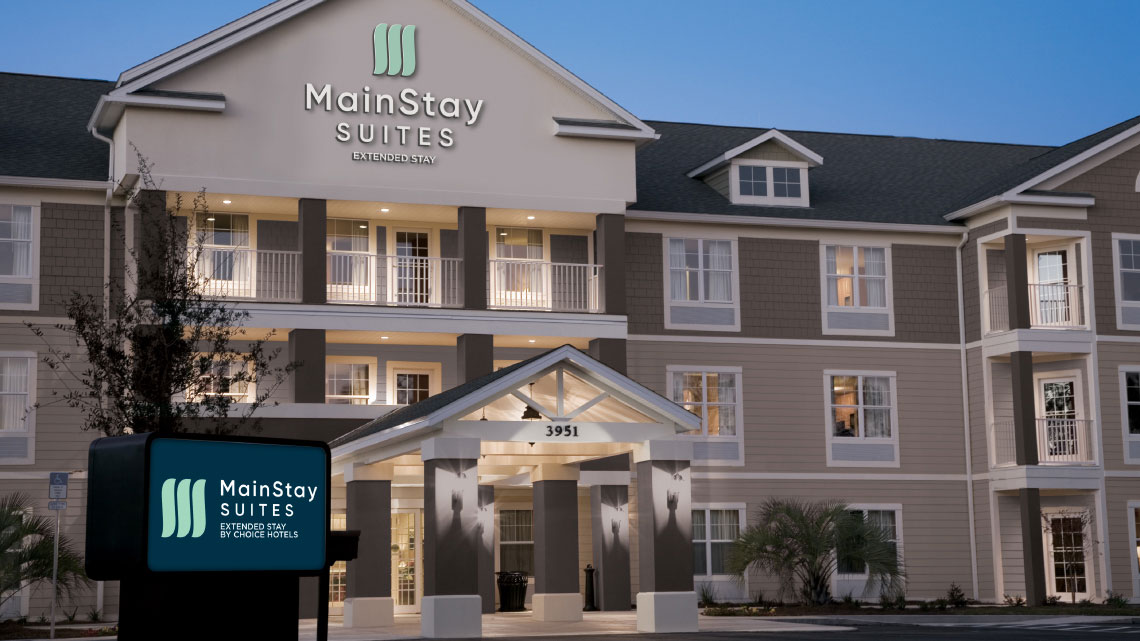 exterior of MainStay Suites hotel for extended stay, lobby entrance, sign