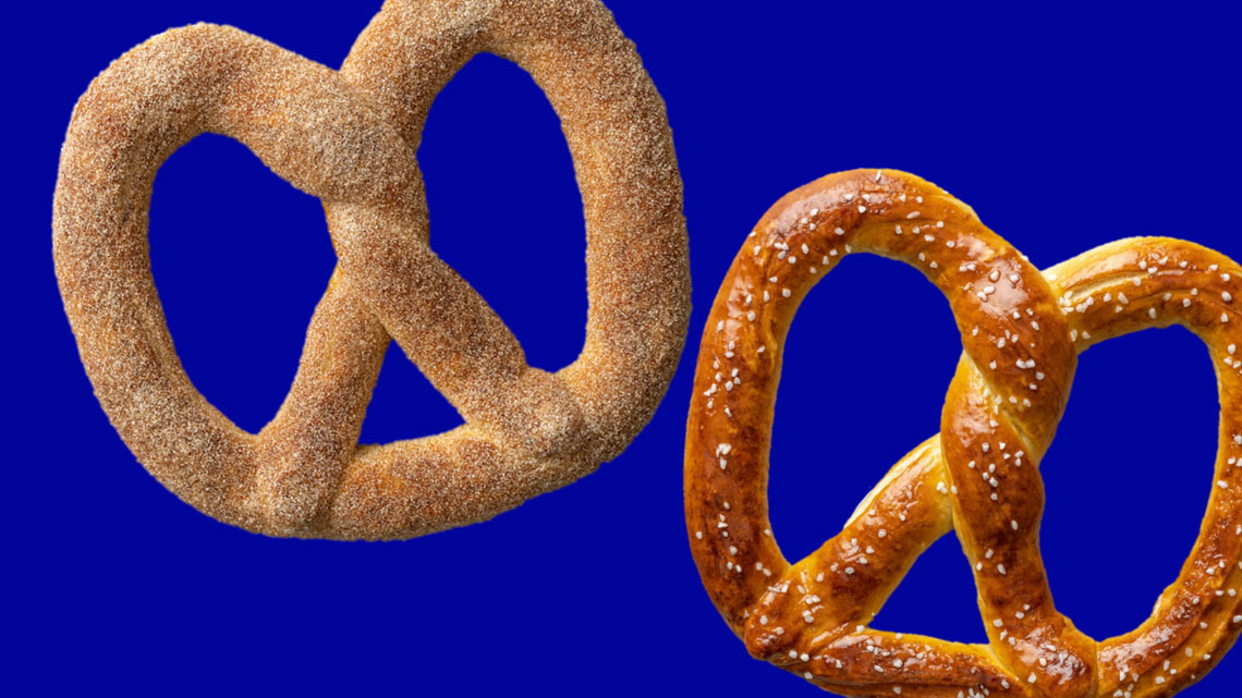 blue background, salted pretzel and cinnamon sugar pretzel