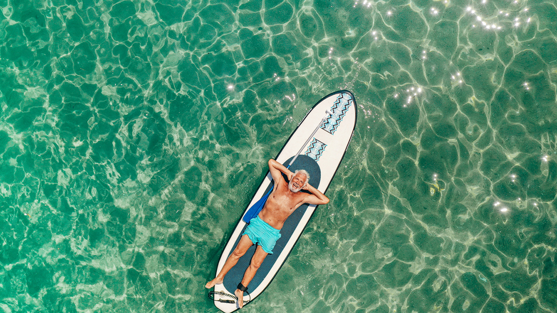Margaritaville Man Relaxing On A Paddleboard