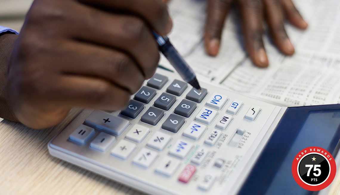 hands using calculator, retirement planning 
