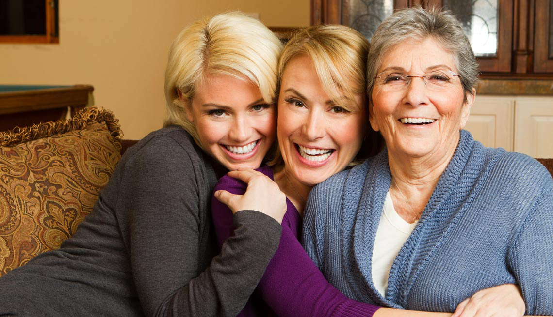 Three generations of women embracing each other