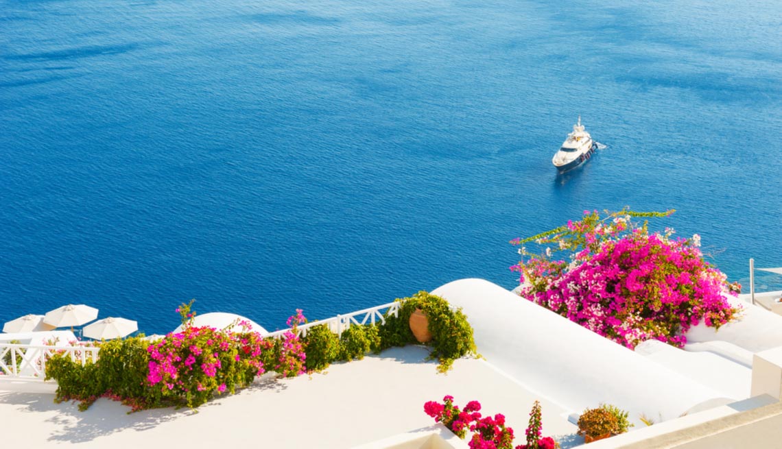 View of a yacht on the mediterranean ocean from a hotel balcony