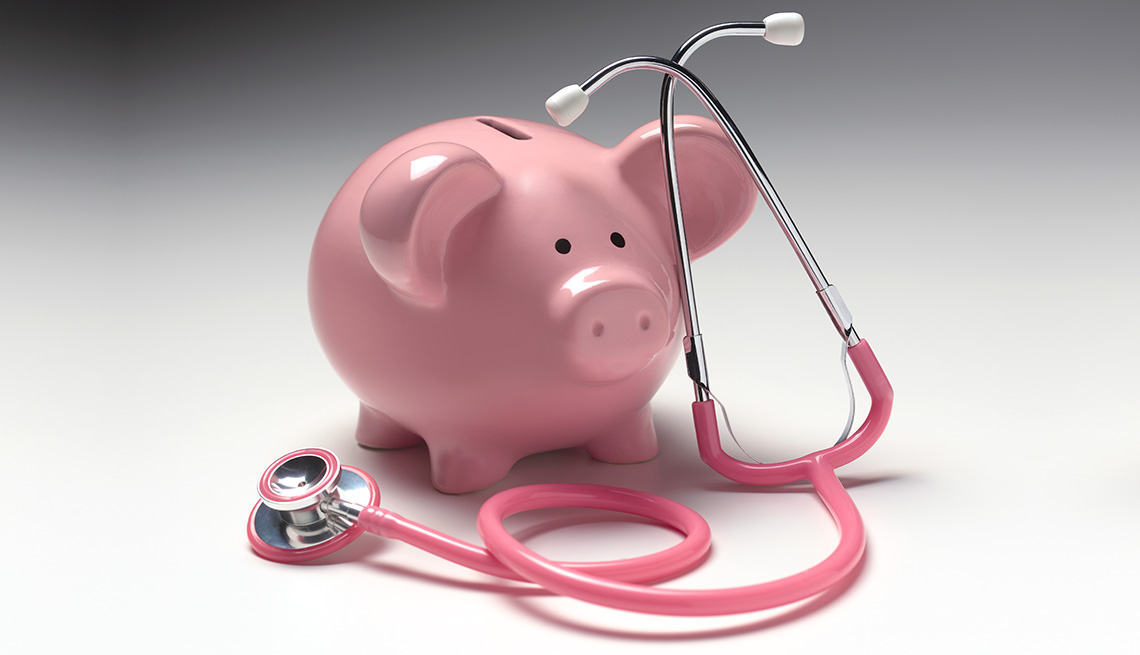 Piggy bank and stethoscope illustrating medical insurance