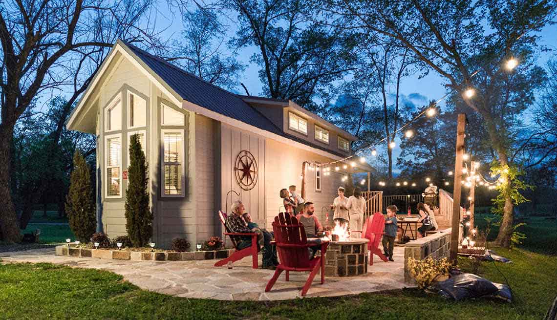 A backyard decorated with lights and at a family gathering