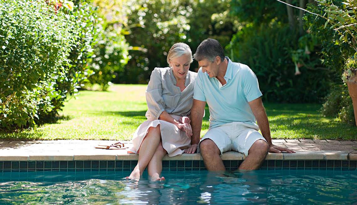 Couple with feet in pool