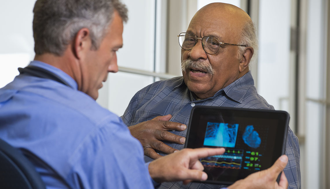 A male patient and his doctor discussing his heart