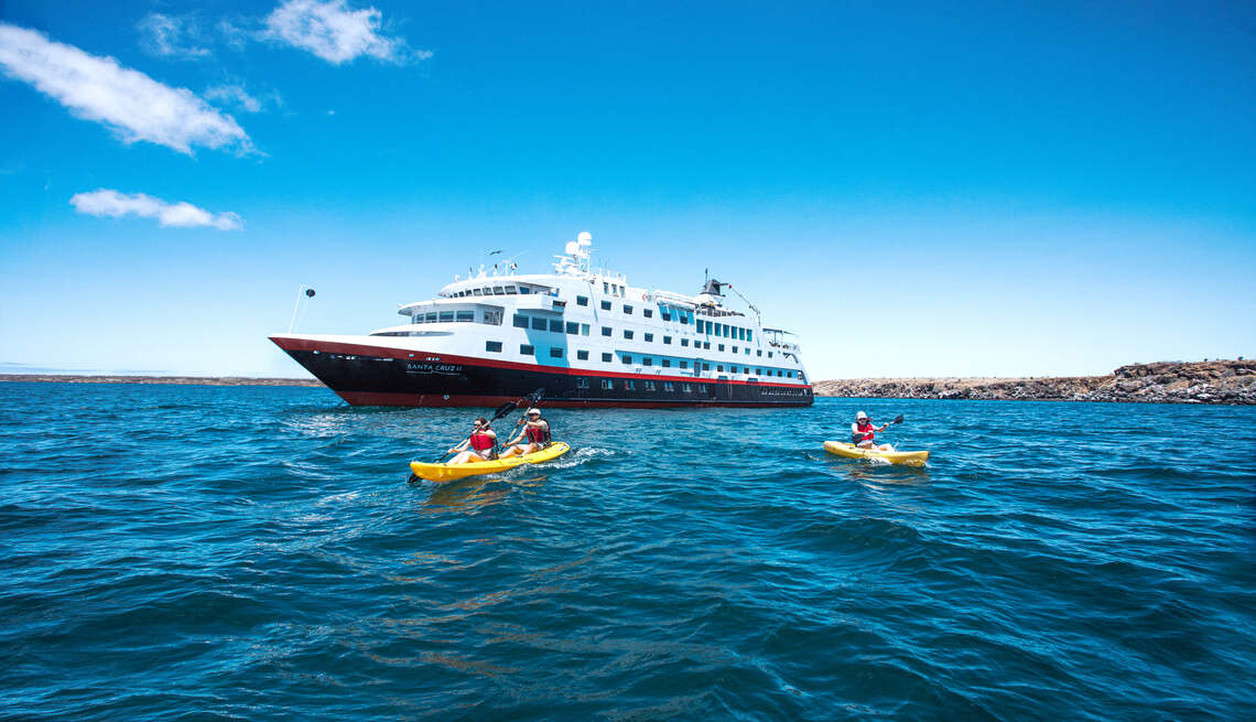 A cruise ship with a paddleboat