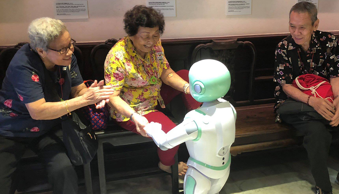 Woman dancing with iPal robot