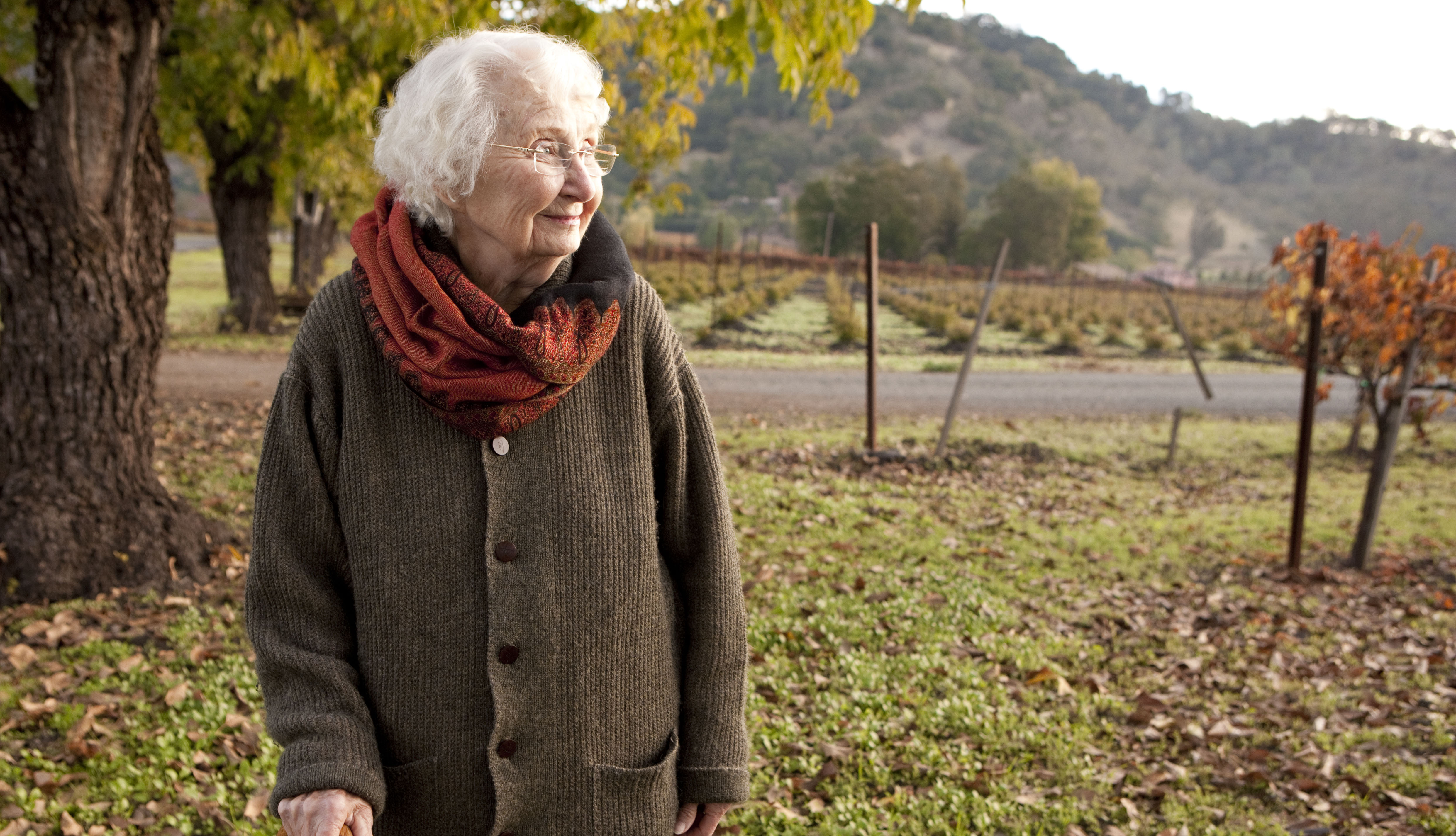 senior woman walking outdoors in the fall