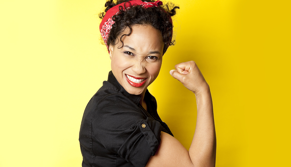 Recreation of We Can Do It Image. Woman smiling and flexing bicep