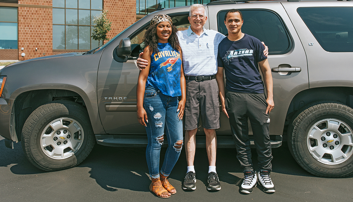 Paul Goetchius with students Tatiana Lee (left) and Vincent Anderson (right), arrive at Genesee Community College in Batavia, NY
