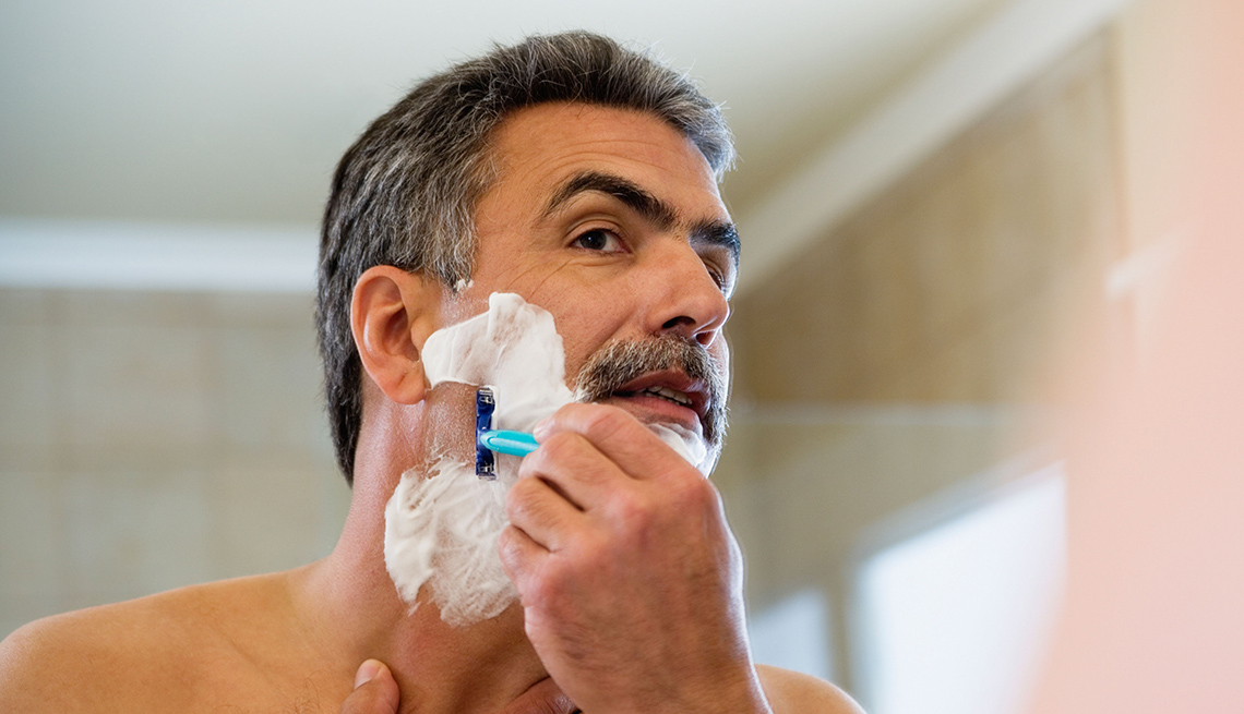 Man Shaves Face In Mirror, Look Younger