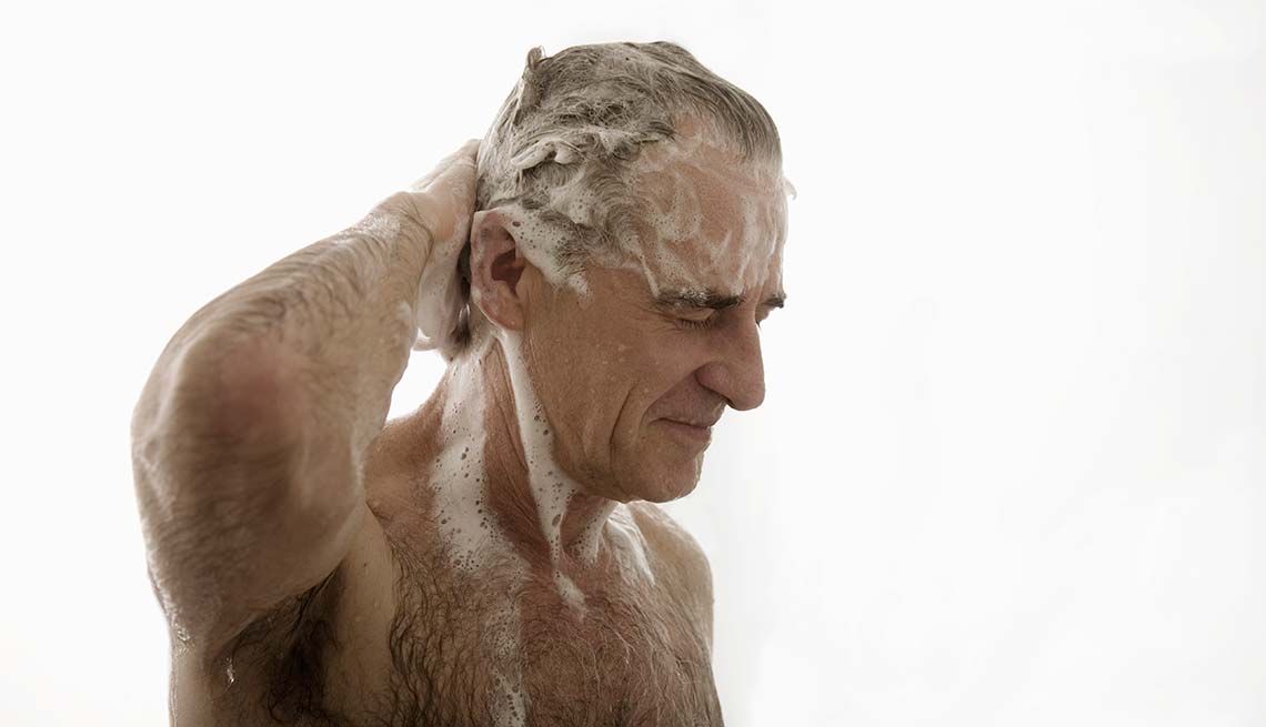 Senior man washing hair in shower, Beauty Tips and Secrets for Men 
