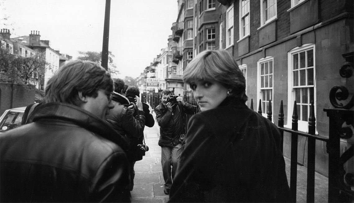 item 5 of Gallery image - Lady Diana Spencer, surrounded by press photographers and reporter Howard Foster shortly before the announcement of her engagement to Charles, Prince of Wales. 