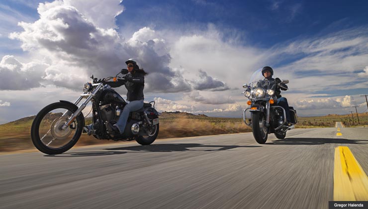 Man and woman riding motorcycles on an open road near Palmdale California