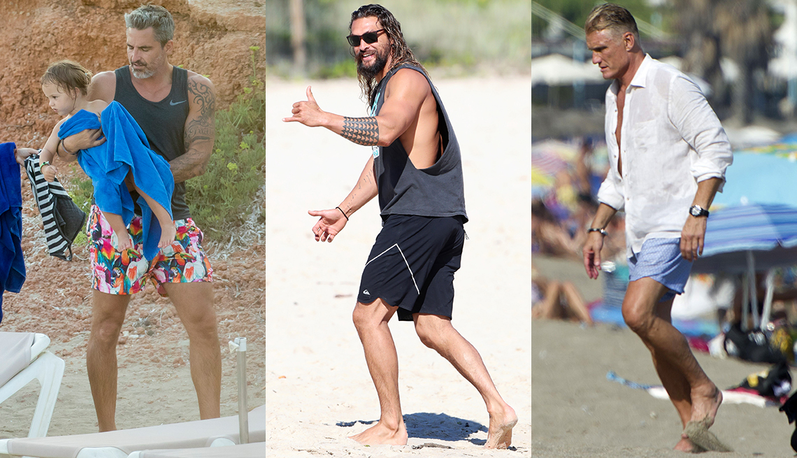 item 8 of Gallery image - Dolph Lundgren in a white shirt and swimsuit; Jason Momoa in black cutaway tank and board shorts; Nicolas Paladini in black muscle tank, pop print shorts to display his tattoos